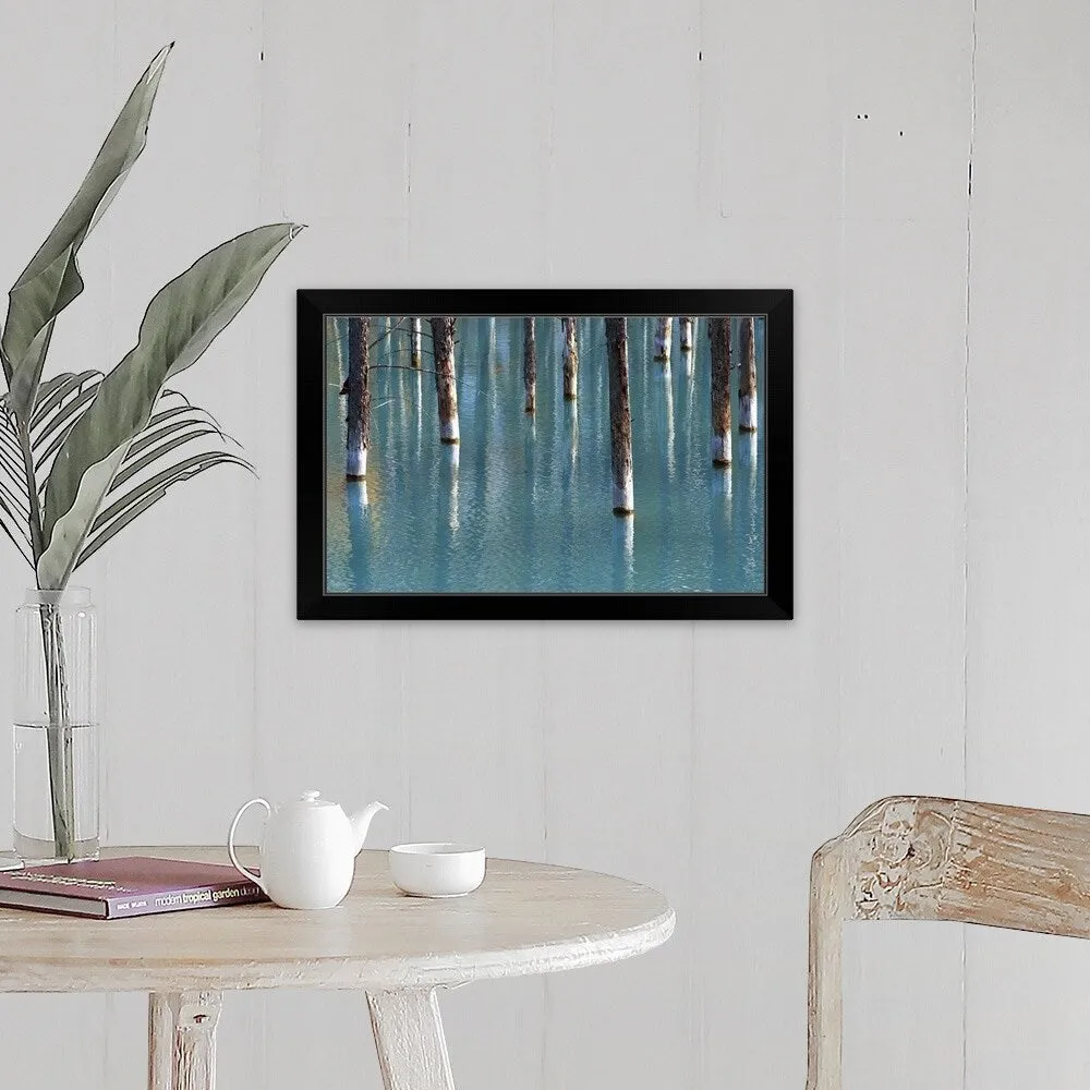 "Autumn tree in blue pond." Black Framed Print