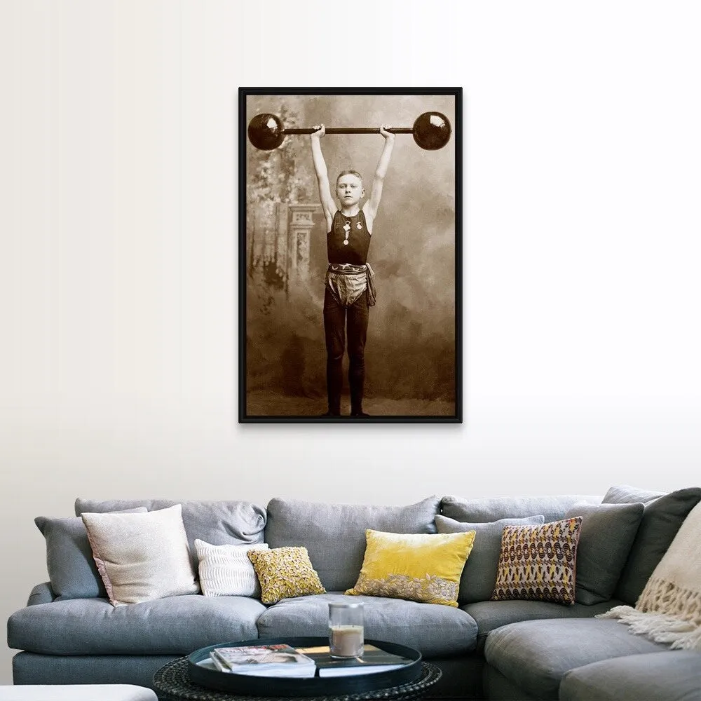 "Boy lifting weights" Black Float Frame Canvas Art