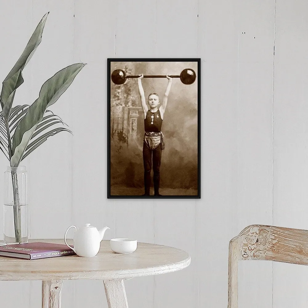 "Boy lifting weights" Black Float Frame Canvas Art